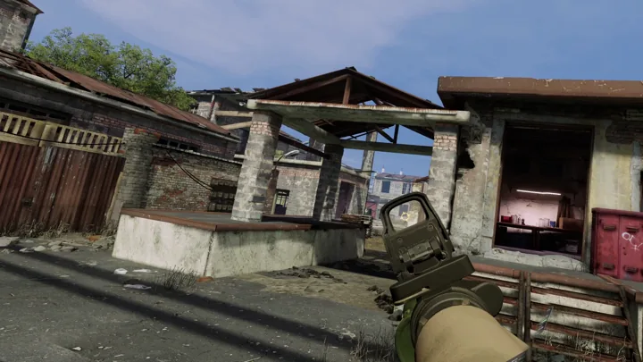 A rifle at the entrance to an open courtyard