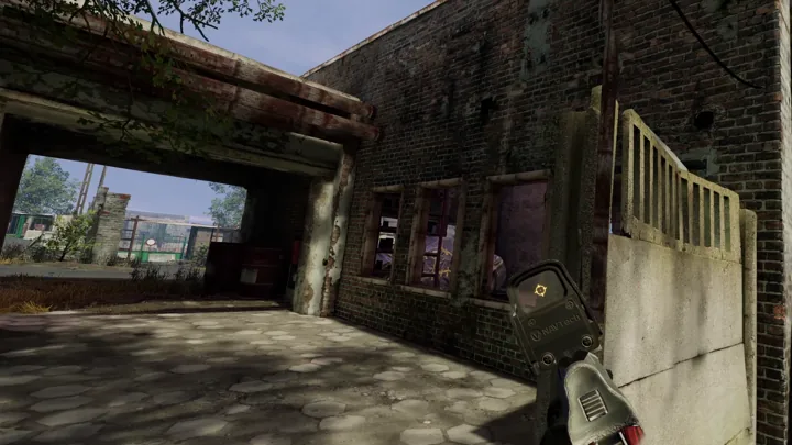 A rifle inside a weathered brick building